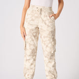 Close up of the practical cargo pocket on the beige tie dye joggers