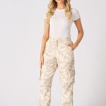 Full front view of a model styling cuffed cargo joggers with a white top