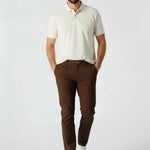 Front view of a man walking in mens dark brown smart trousers