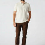Man standing casually in dark brown trousers mens UK