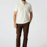 Man standing casually in dark brown trousers mens UK