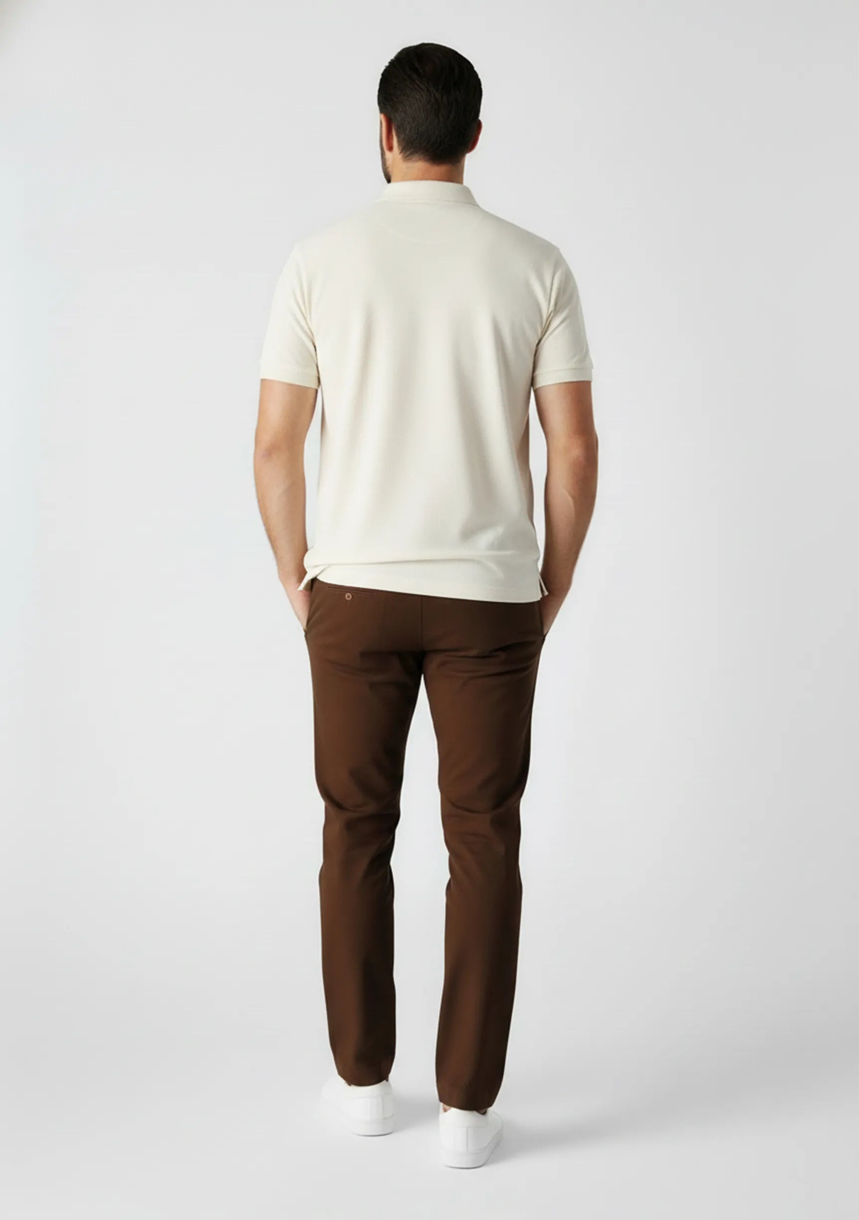 Back view of dark brown slim fit pants showing pocket details