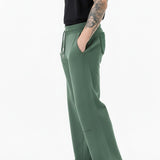 side profile of dark green wide leg joggers
