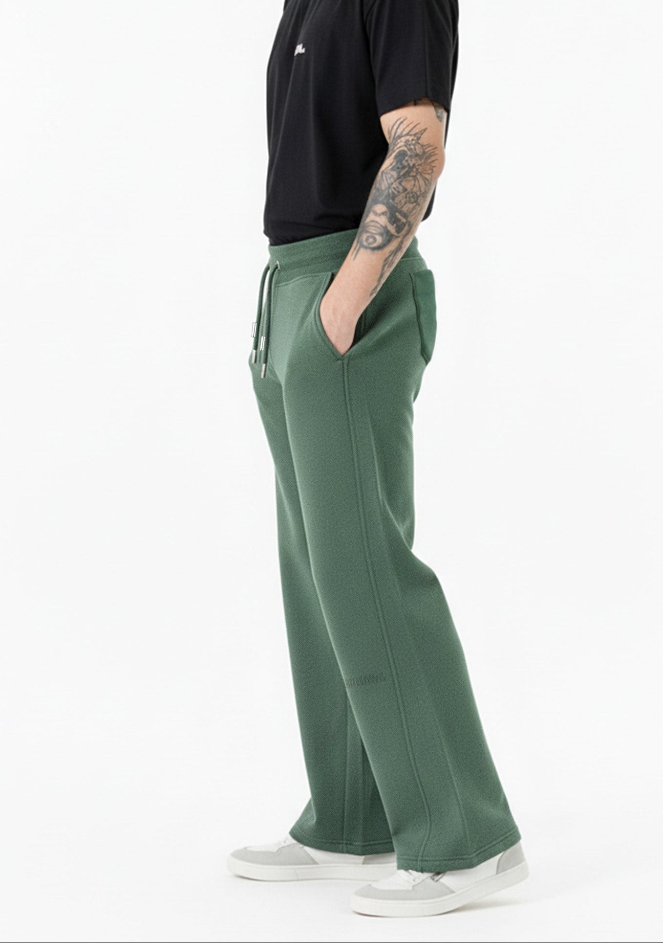 side profile of dark green wide leg joggers