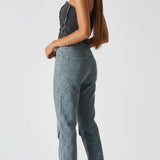 Back and side angle of distressed black corset top showing zipper closure - women's strapless denim bustier with cargo jeans