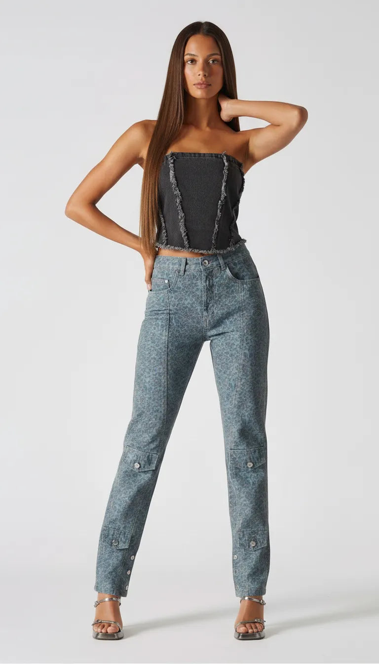 Front pose of black wash corset top with hand behind neck showing raw hem detail - women's textured denim bustier with cargo jeans