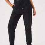 Close up detail of drawstring waist and pockets on black jogger