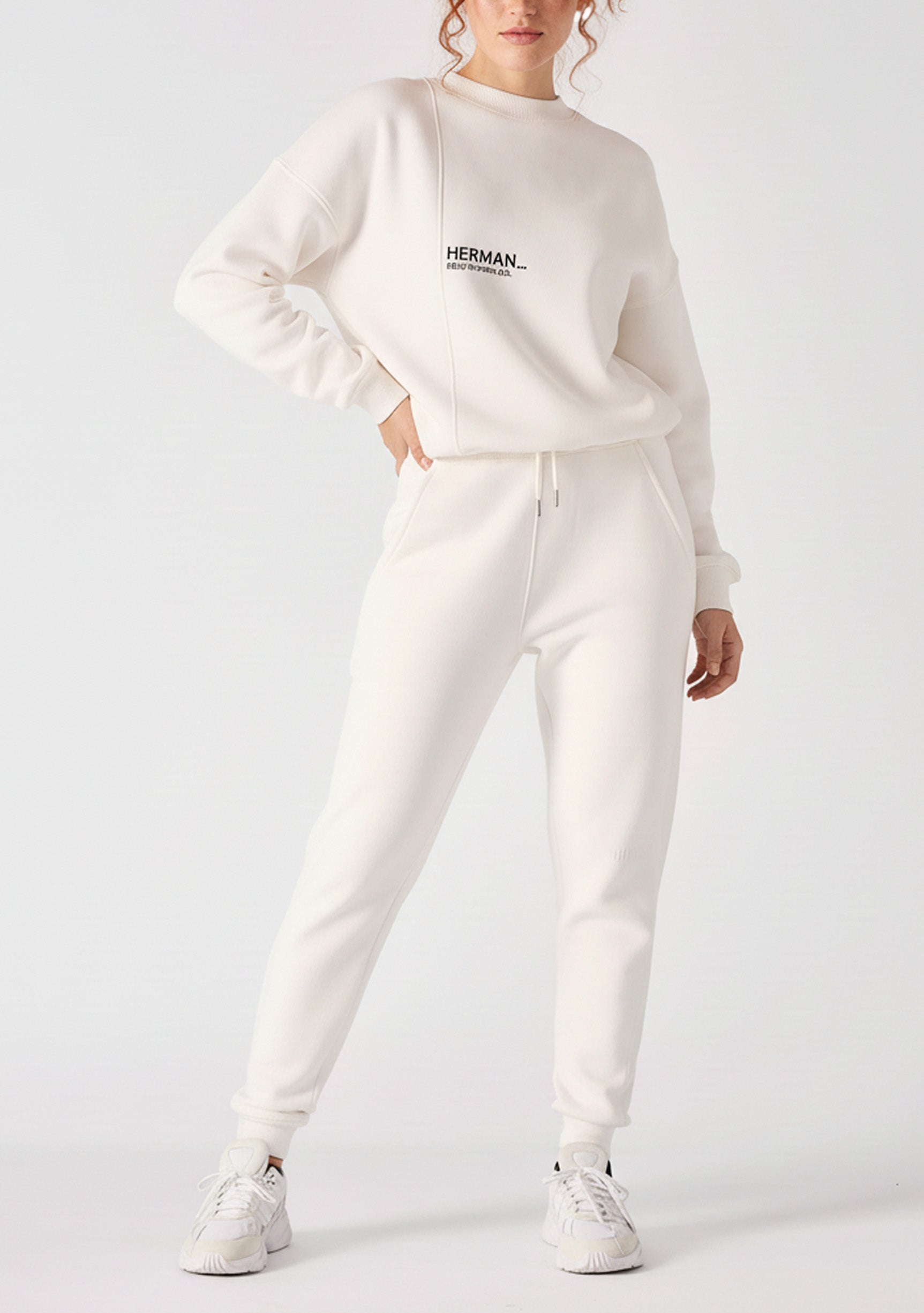 Full front shot of a model wearing high quality female white sweatpants.