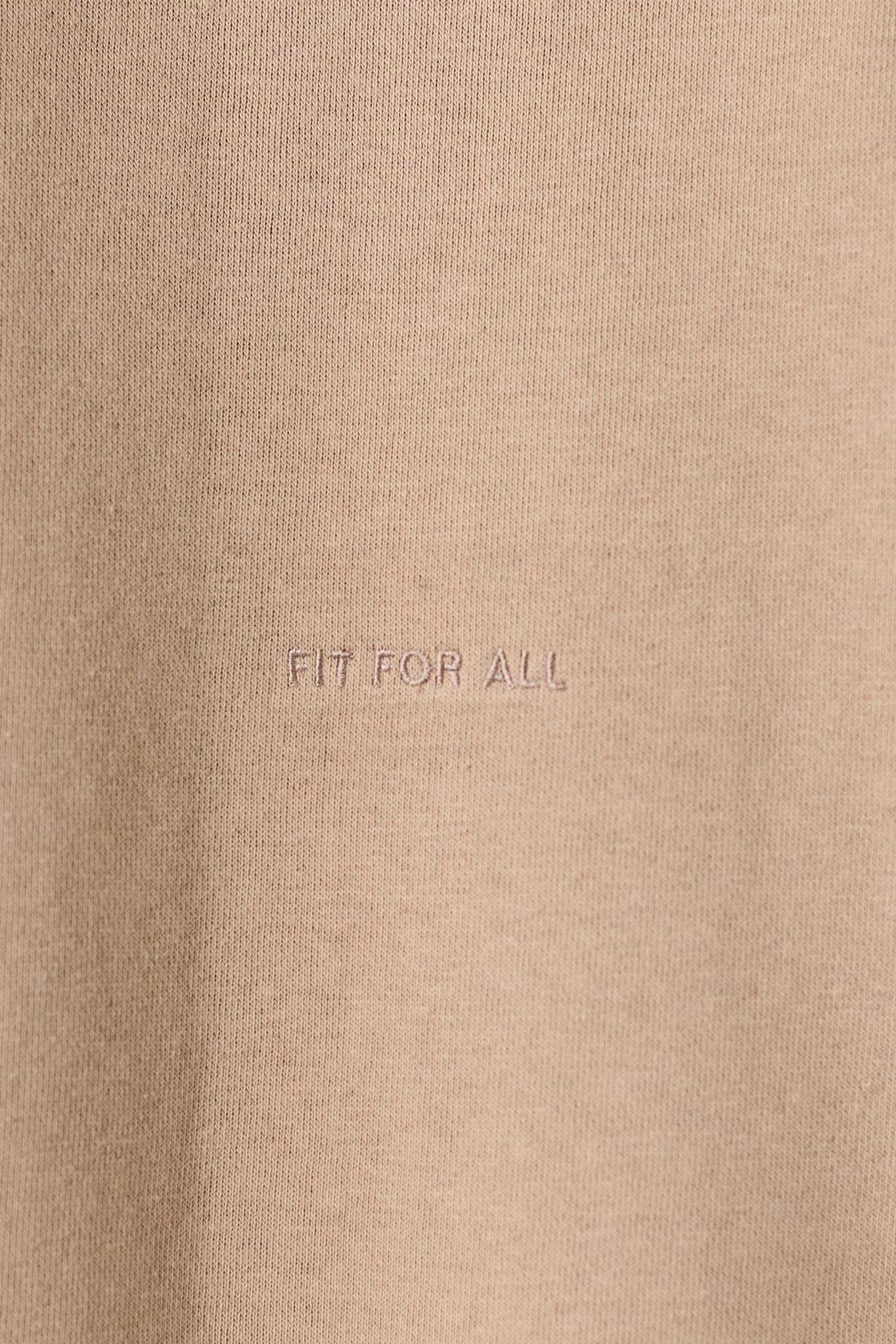Close-up of the 'Fit For All' tonal embroidery detail