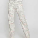 Floral-patterned jeans worn by a person on a white background