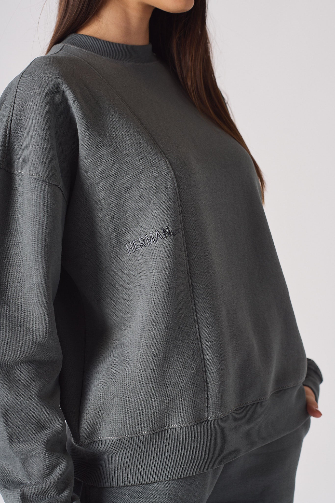 mid shot casual pose in grey crew neck jumper