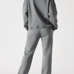 Rear view showing the comfortable fit of the grey cuffed joggers womens.