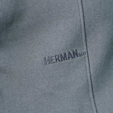 close up of tonal chest embroidery on grey oversized jumper
