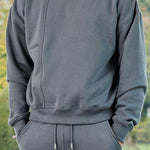 front view wearing grey oversized crew neck jumper