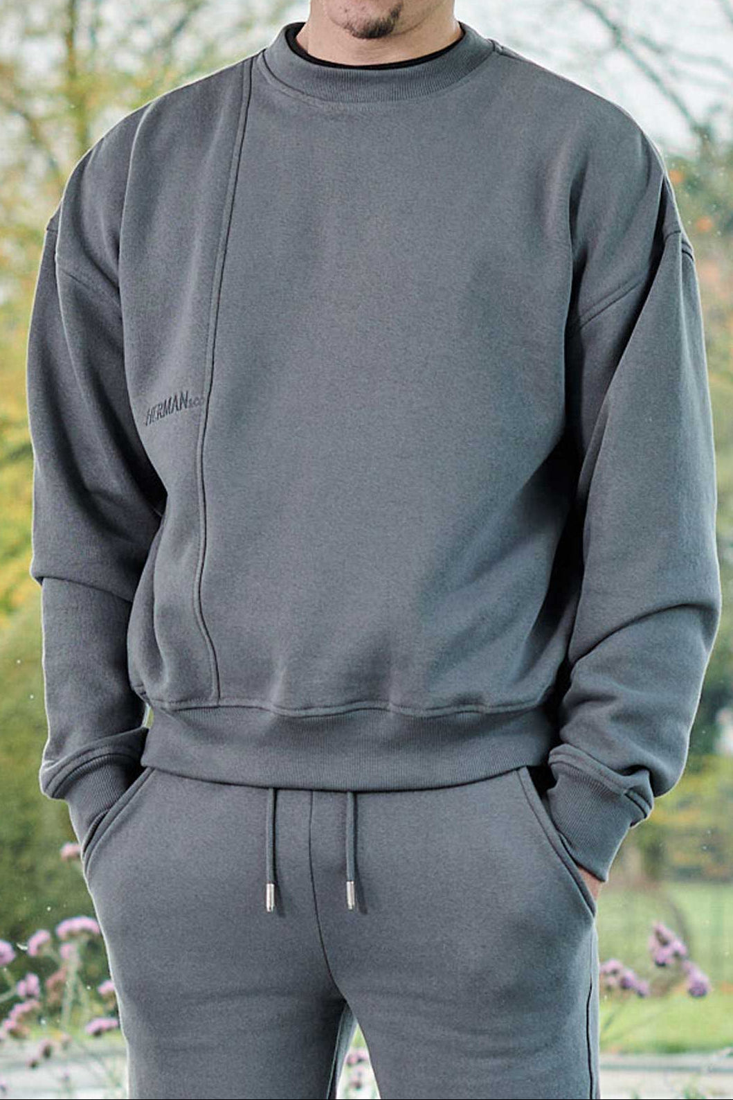 front view wearing grey oversized crew neck jumper