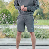 full length view in grey oversized crew neck jumper with matching shorts