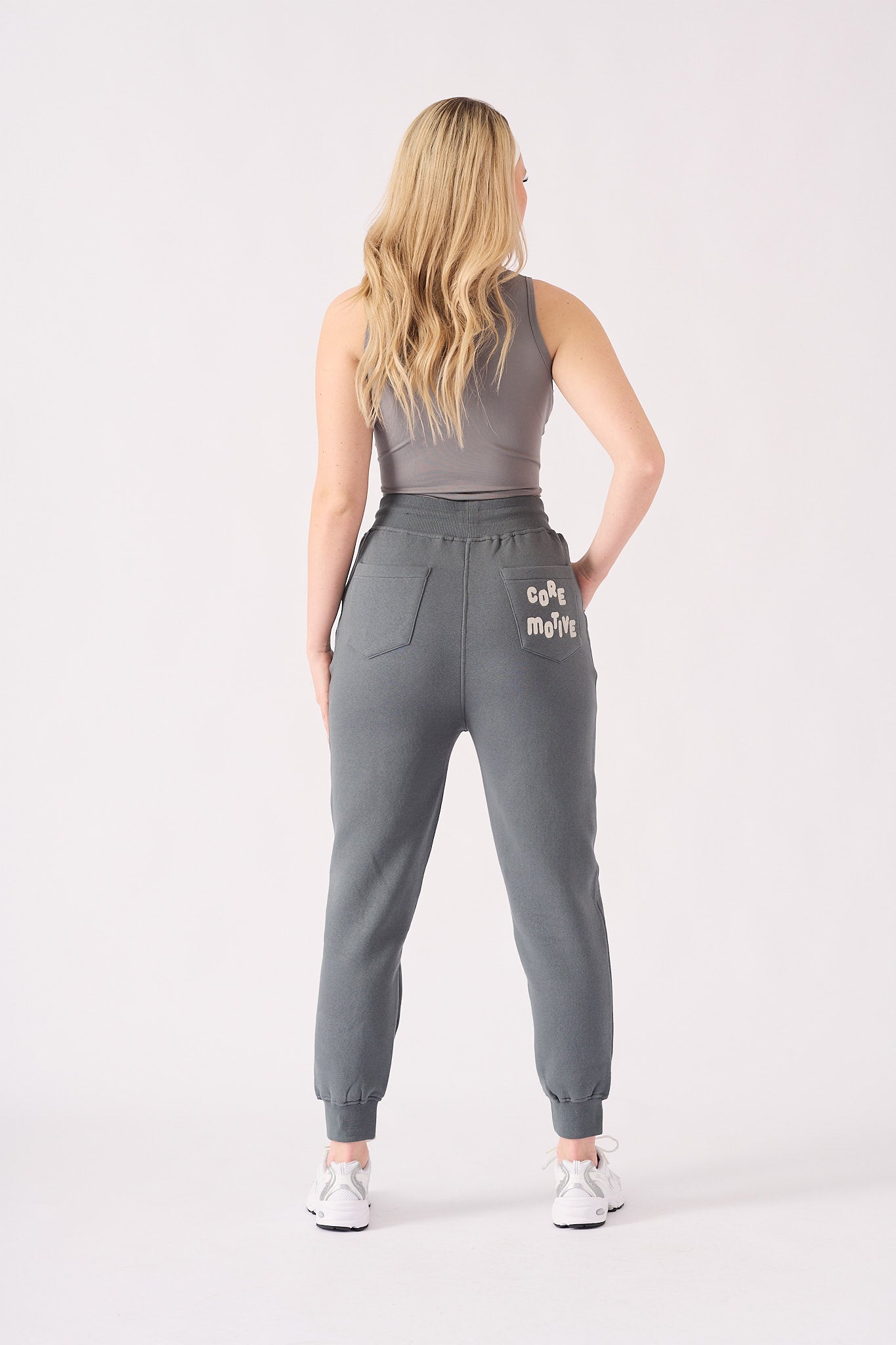 Rear view showing the clean fit and silhouette of the grey tapered joggers womens.