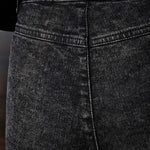 Close-up of the black Herman & Co logo patch on the back of the jeans