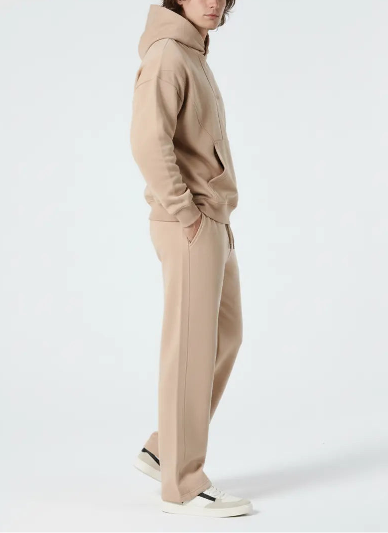 Side profile of the Herman men's beige popper neck hoodie and joggers set.