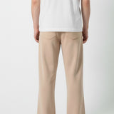 Back view of the Herman men's beige wide-leg joggers showing the patch pockets.