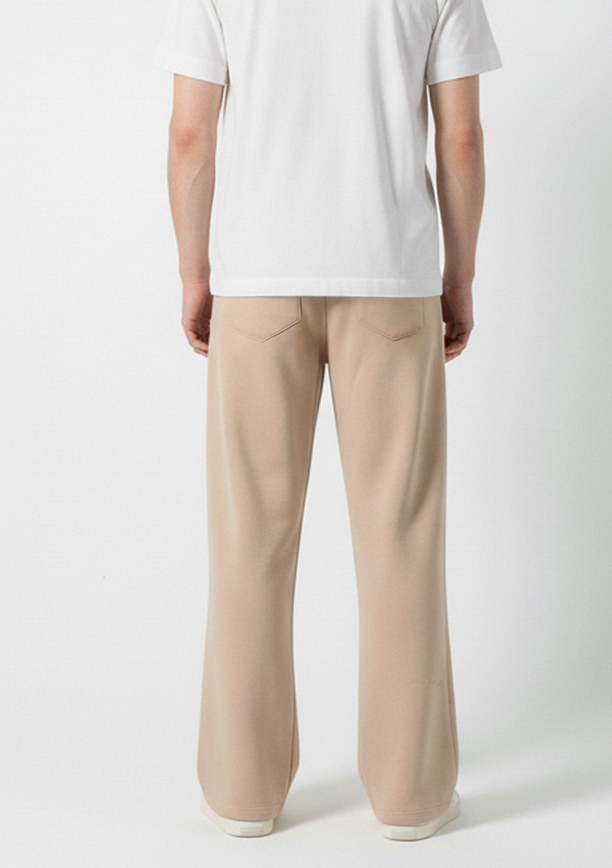 Back view of the Herman men's beige wide-leg joggers showing the patch pockets.