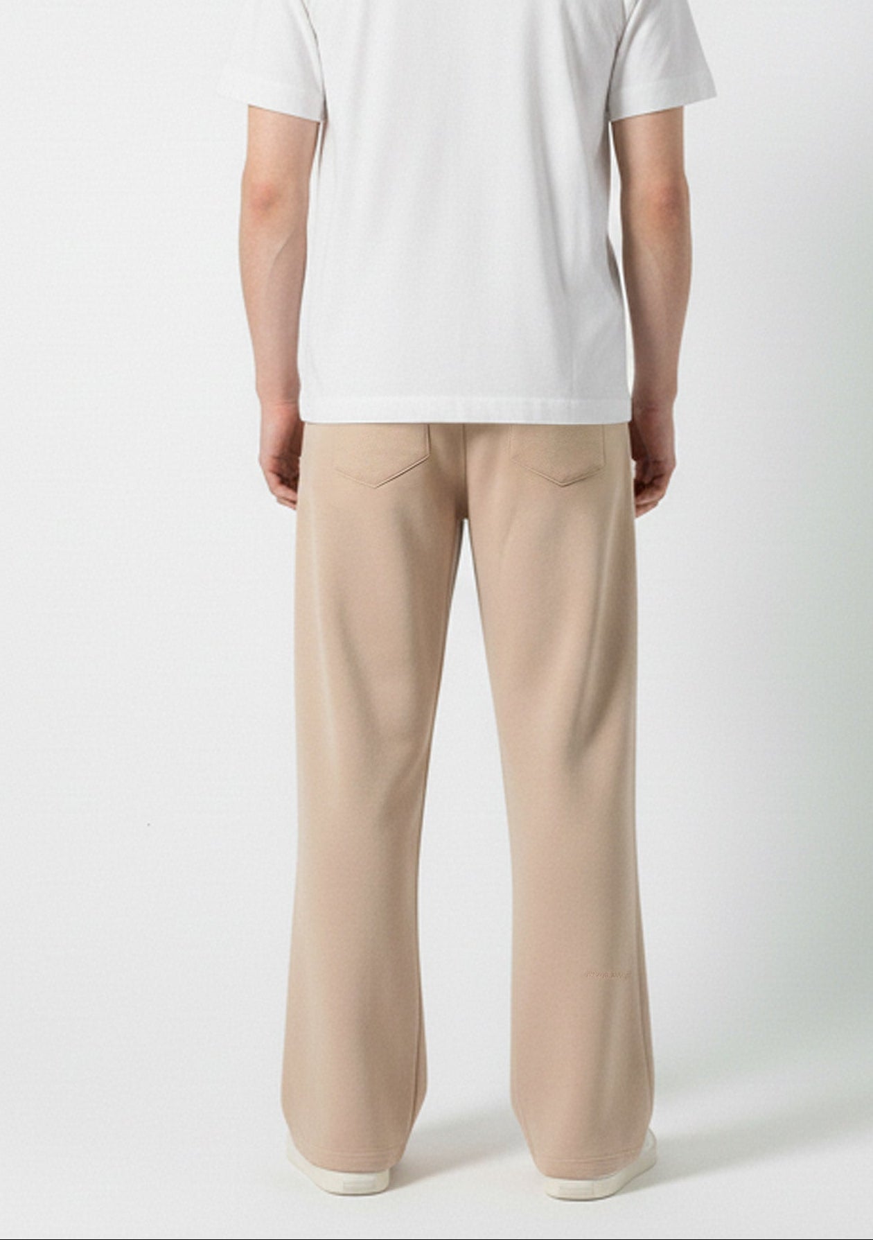 Back view of the Herman men's beige wide-leg joggers showing the patch pockets.