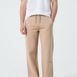 Front view of the Herman men's beige wide-leg joggers styled with a white t-shirt.