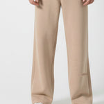 Full look of a model wearing the Herman men's beige wide-leg joggers.