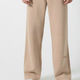 Full look of a model wearing the Herman men's beige wide-leg joggers.
