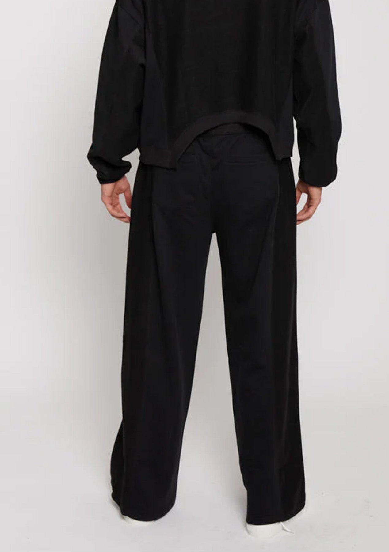 Back view of the Herman men's black wide-leg joggers showcasing the full silhouette.