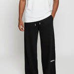 Front view of the Herman men's black wide-leg joggers, styled with a white t-shirt.