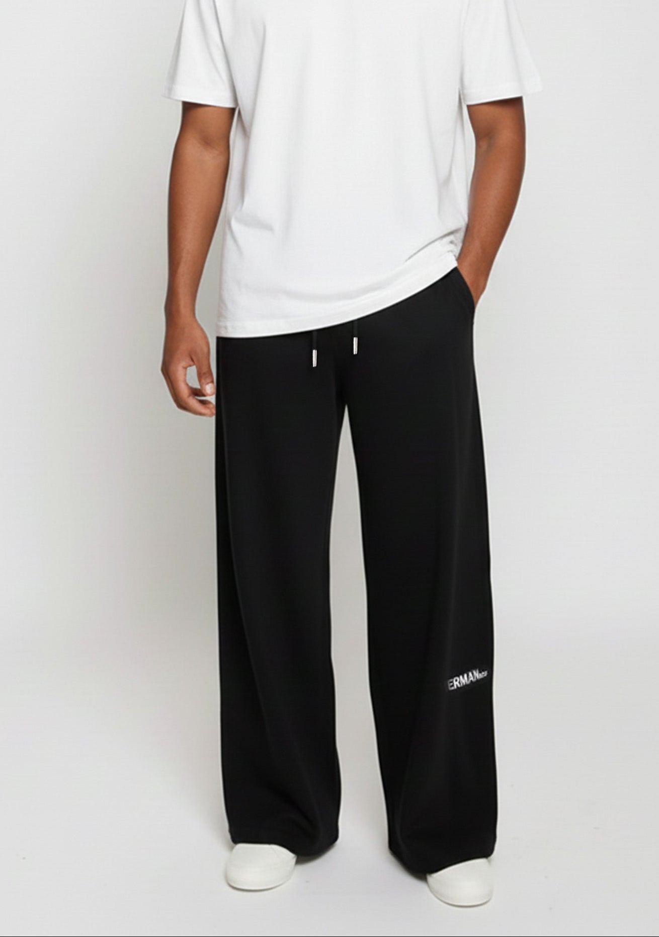 Front view of the Herman men's black wide-leg joggers, styled with a white t-shirt.