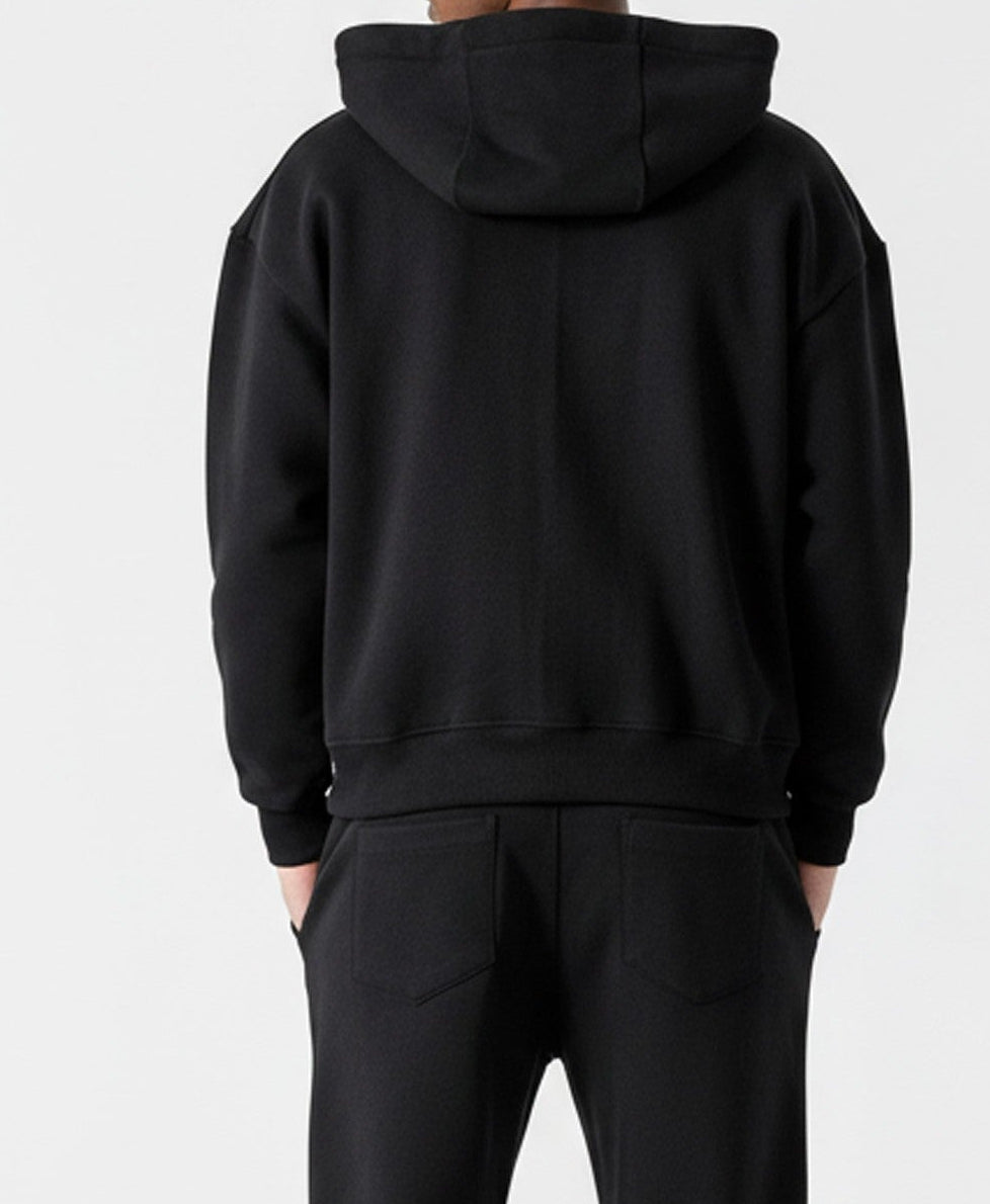 Back view of the Herman men's black oversized hoodie and tracksuit set