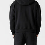 Back view of the Herman men's black oversized hoodie and tracksuit set