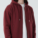 Angled front view of the Herman men's oversized burgundy zip hoodie.