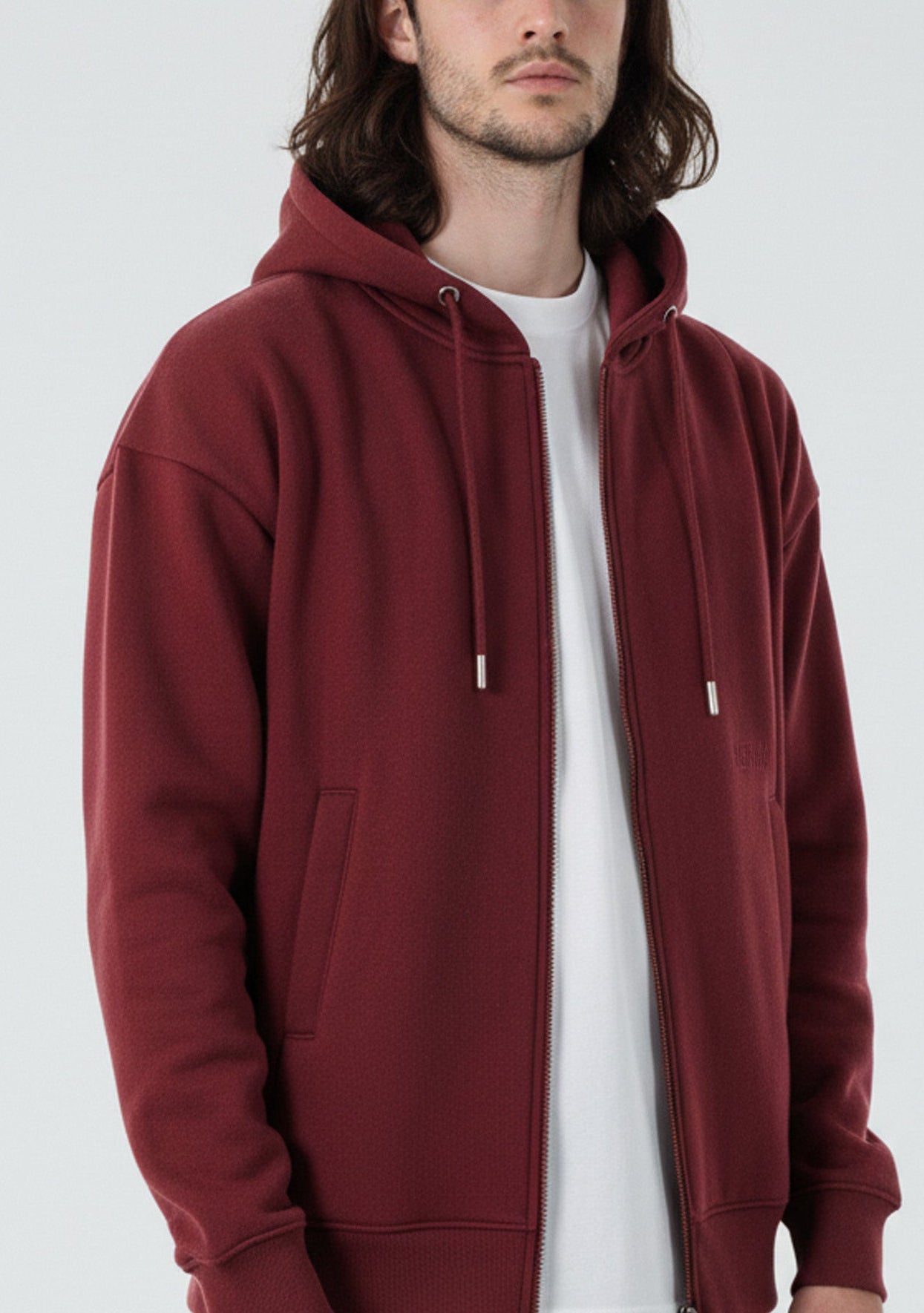 Angled front view of the Herman men's oversized burgundy zip hoodie.