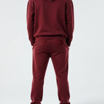 Back view of the Herman men's burgundy zip hoodie and tracksuit set.
