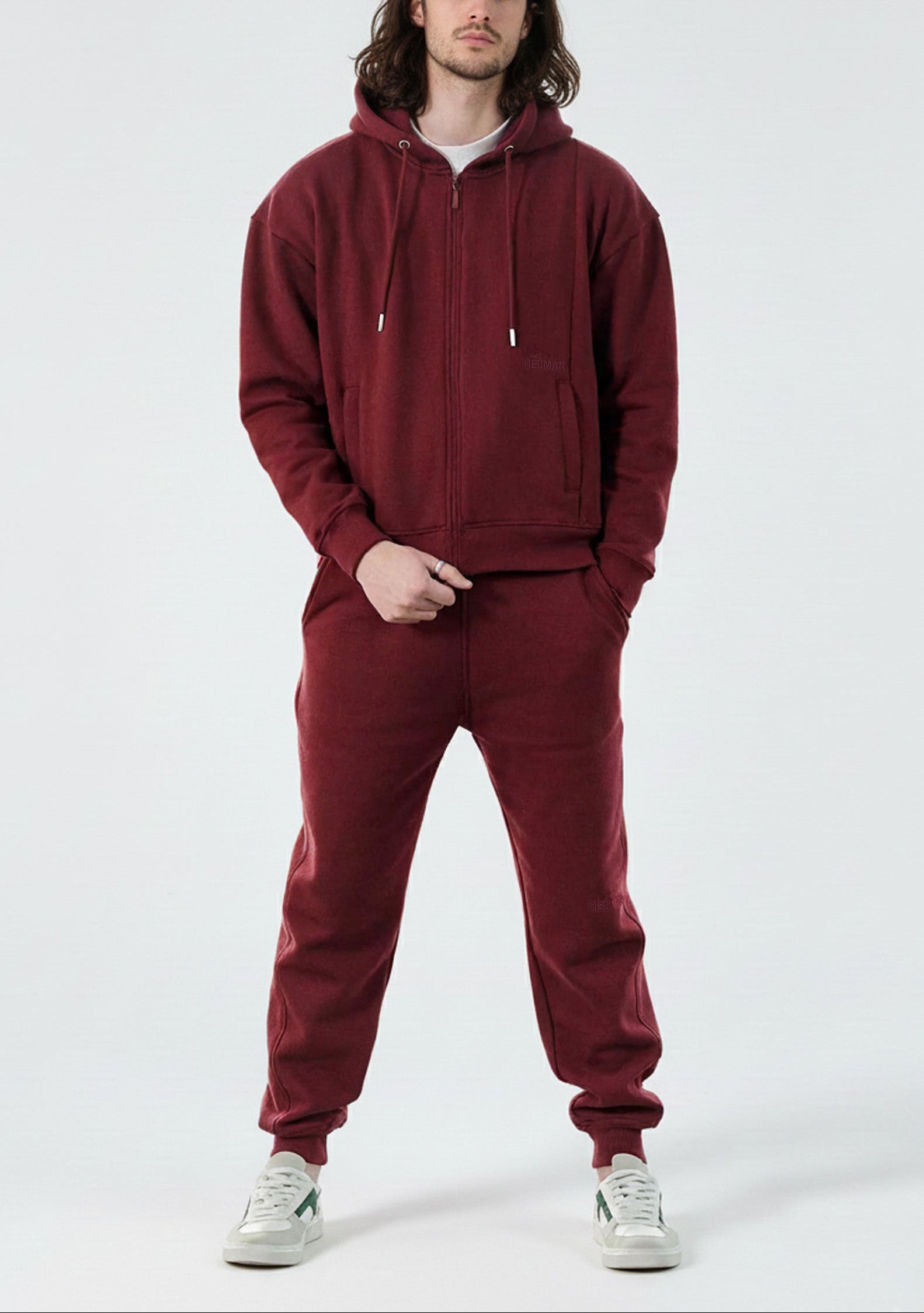 Model styled in the complete Herman men's burgundy loungewear tracksuit.