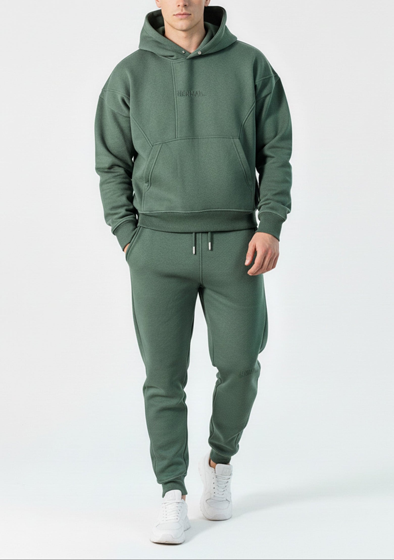 Angled front view of the Herman men's green oversized popper neck hoodie.