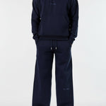 Front view of the Herman men's navy popper neck hoodie and wide-leg joggers.