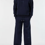 Front view of the Herman men's navy popper neck hoodie and wide-leg joggers.