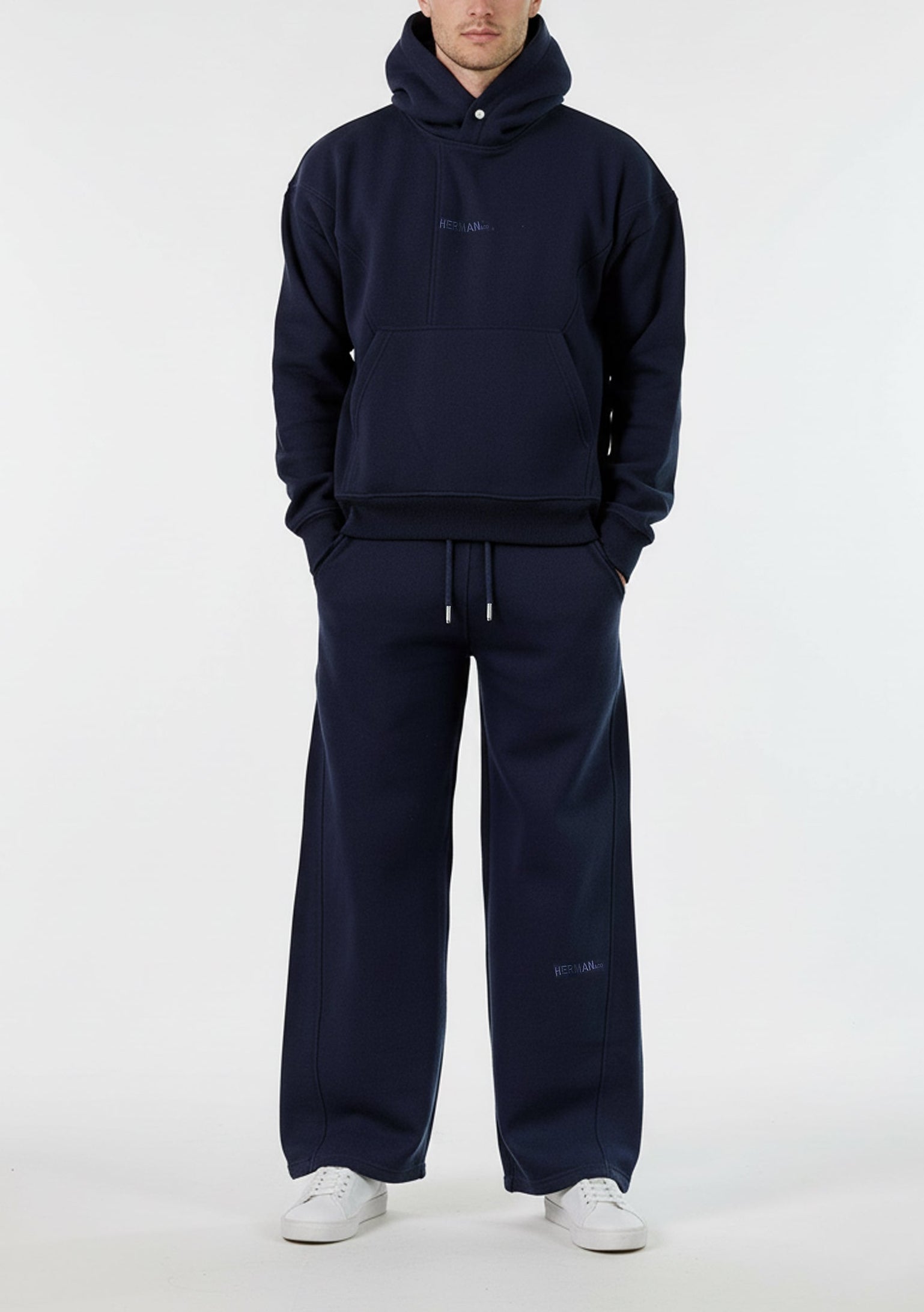 Front view of the Herman men's navy popper neck hoodie and wide-leg joggers.