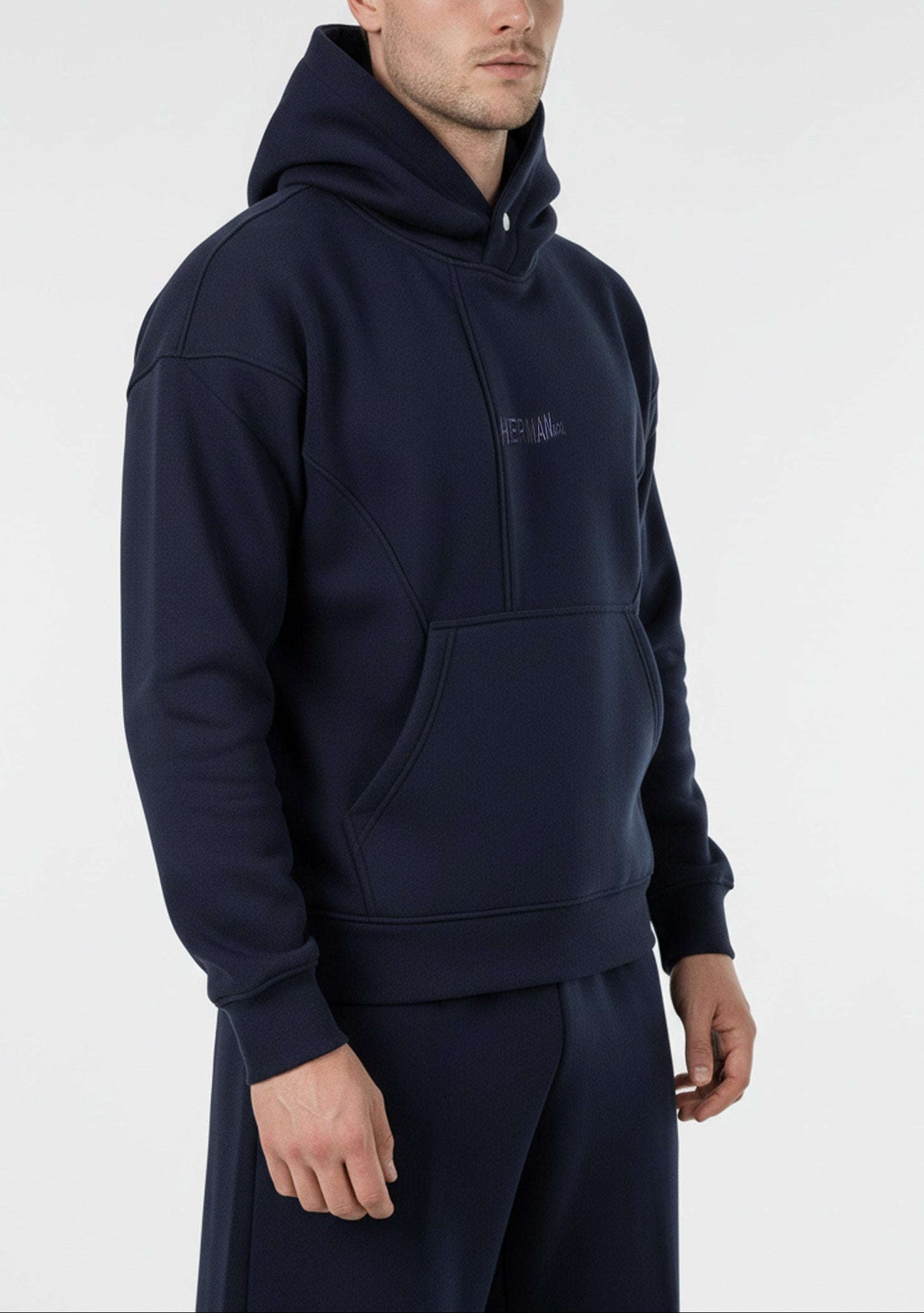 Side view close-up of the Herman men's navy popper neck hoodie.