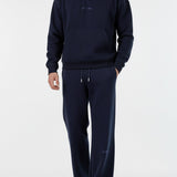 Model wearing the full Herman men's navy loungewear set.