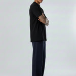 Full side profile of the Herman men's navy wide-leg joggers.