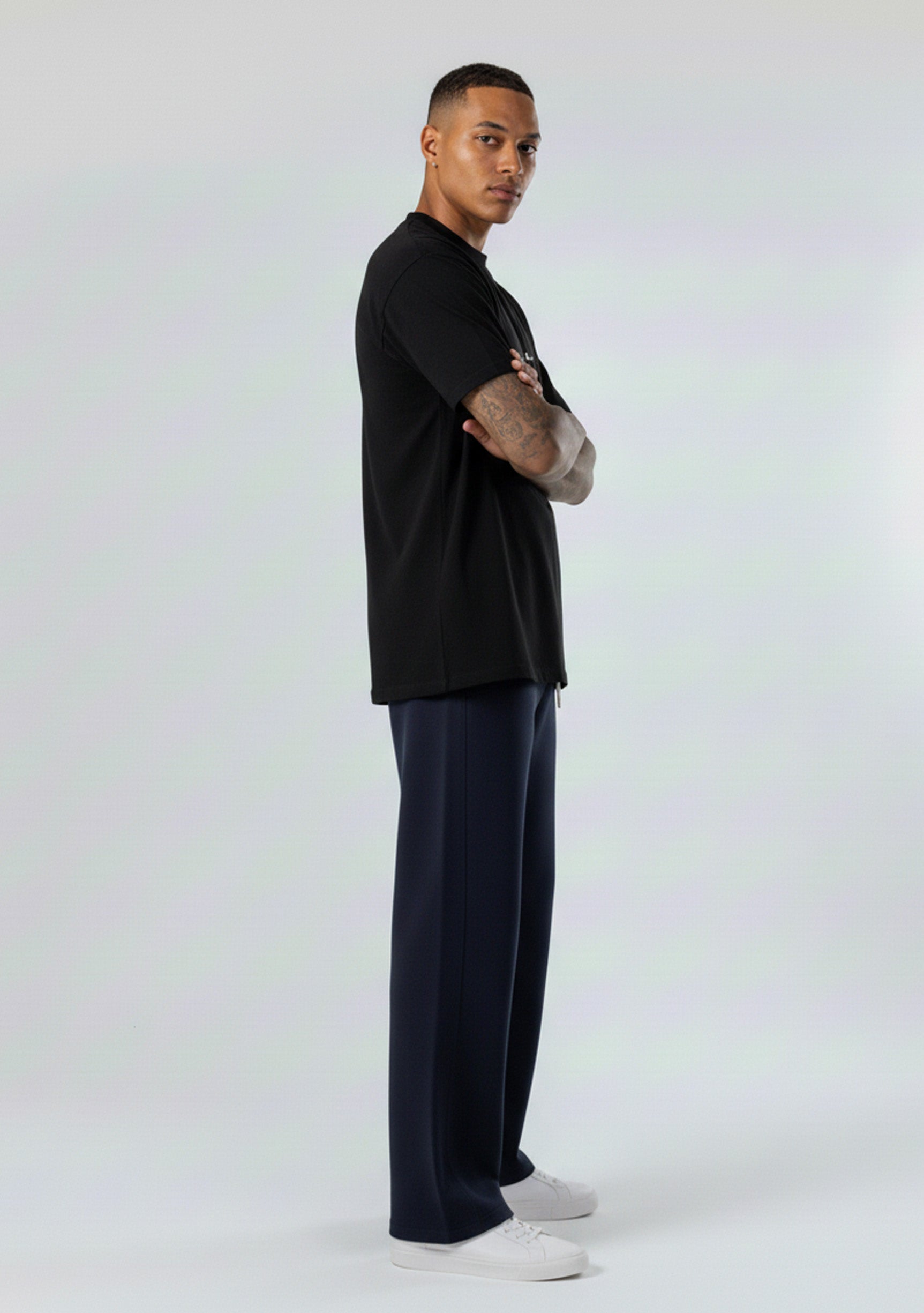 Full side profile of the Herman men's navy wide-leg joggers.