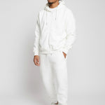 Model styled in the complete Herman white loungewear set featuring the oversized zip hoodie
