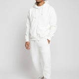 Model styled in the complete Herman white loungewear set featuring the oversized zip hoodie