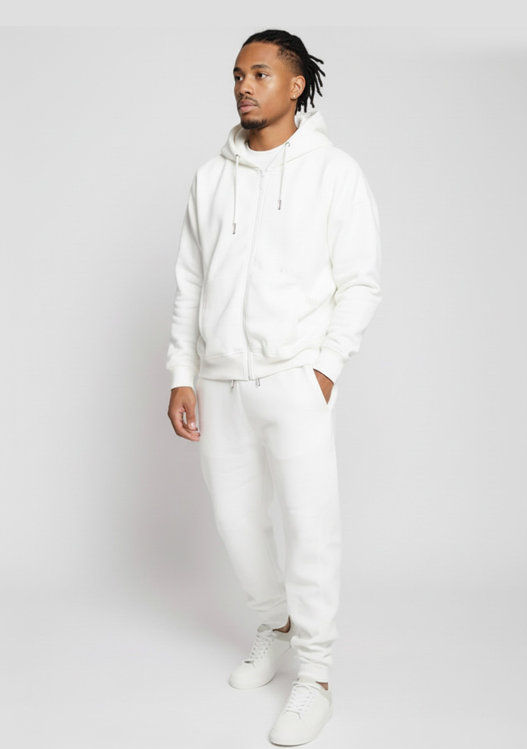 Model styled in the complete Herman white loungewear set featuring the oversized zip hoodie