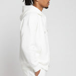Side profile close up of the Herman men's white zip hoodie showcasing the soft fabric and fit